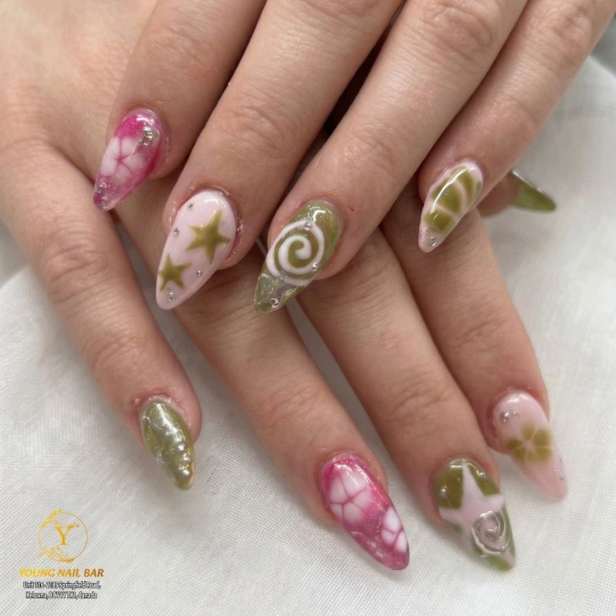 Mixed nail art with stars and swirls