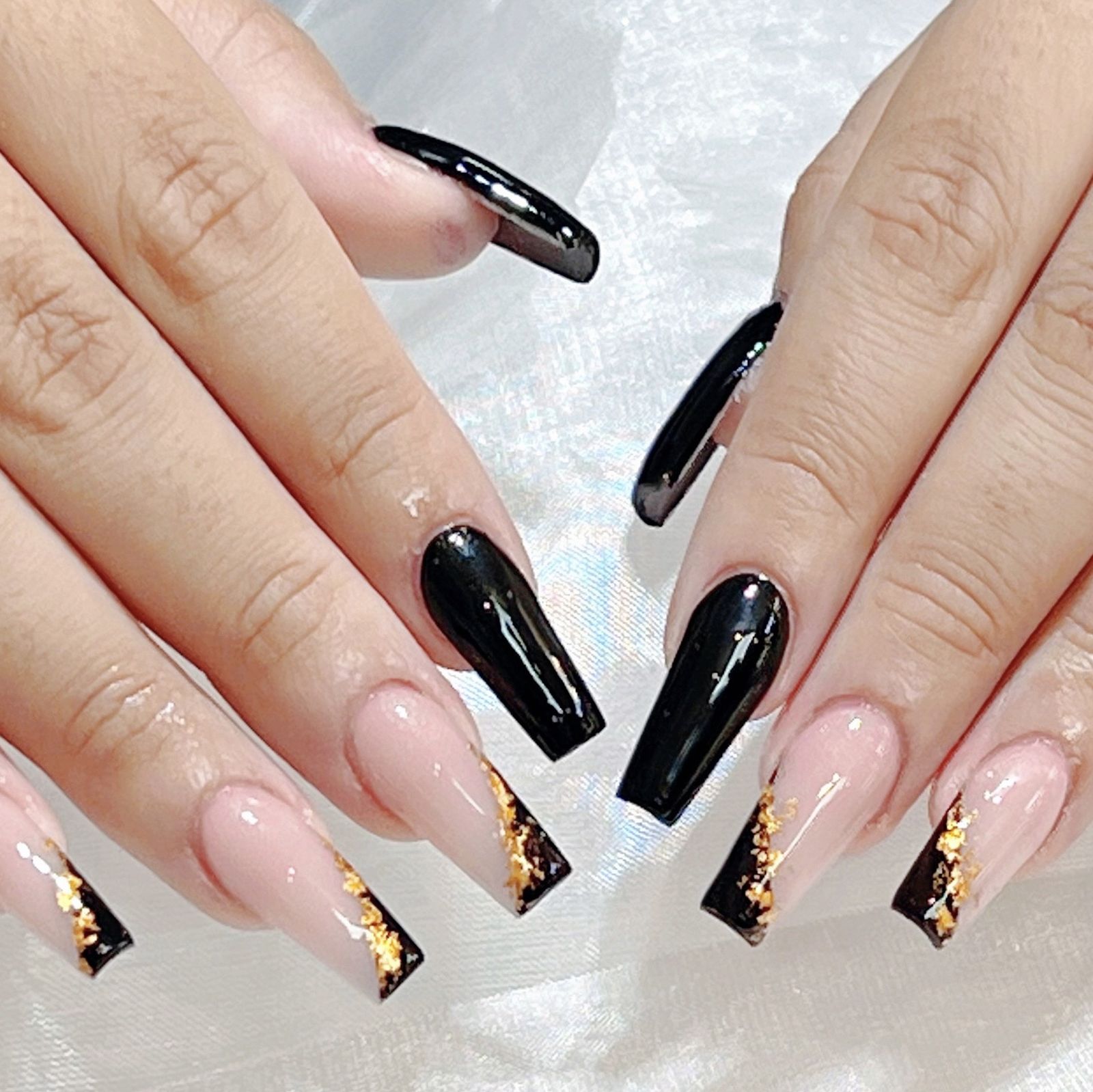 Black french tips with gold leaf